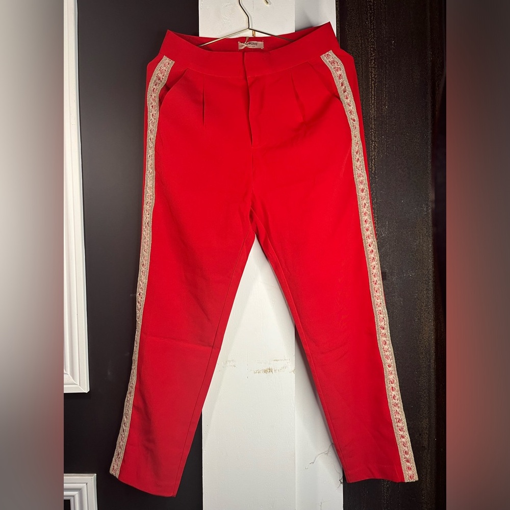 Red pants with gold trim